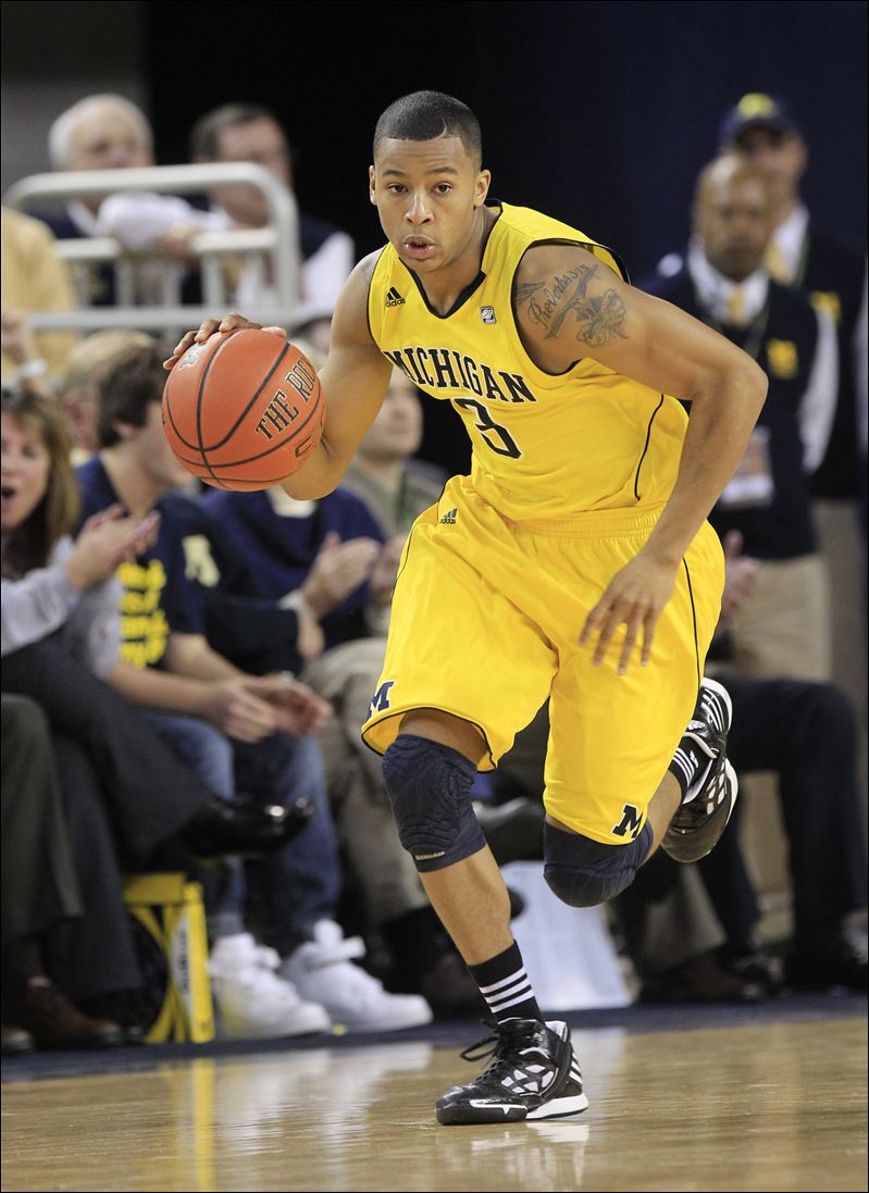 Burke-decides-to-stay-at-Michigan