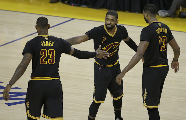 Cleveland Cavaliers guard Kyrie Irving (2), forward LeBron James (23) and center Tristan Thompson (13) react during the second half of Game 5 of basketball's NBA Finals against the Golden State Warriors in Oakland, Calif., Monday, June 13, 2016. (AP Photo/Marcio Jose Sanchez)