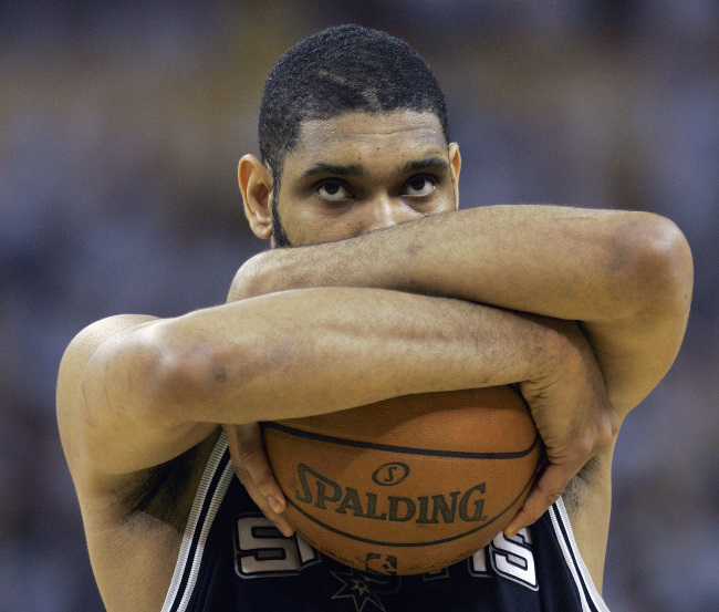 San Antonio Spurs forward Tim Duncan holds the ball near the start of the game against the New Orleans Hornets in the first half of Game 7 of an NBA Western Conference semifinals basketball playoff series Monday, May 19, 2008, in New Orleans. (AP Photo/Alex Brandon)